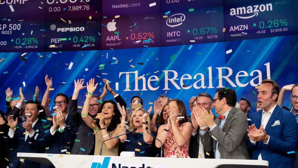 Julie Wainwright, center, CEO of The RealReal, celebrates her company's IPO at the Nasdaq opening bell, in New York. The online reseller of luxury brand clothing and accessories is based in San FranciscoFinancial Markets RealReal IPO, New York, USA - 28 Jun 2019