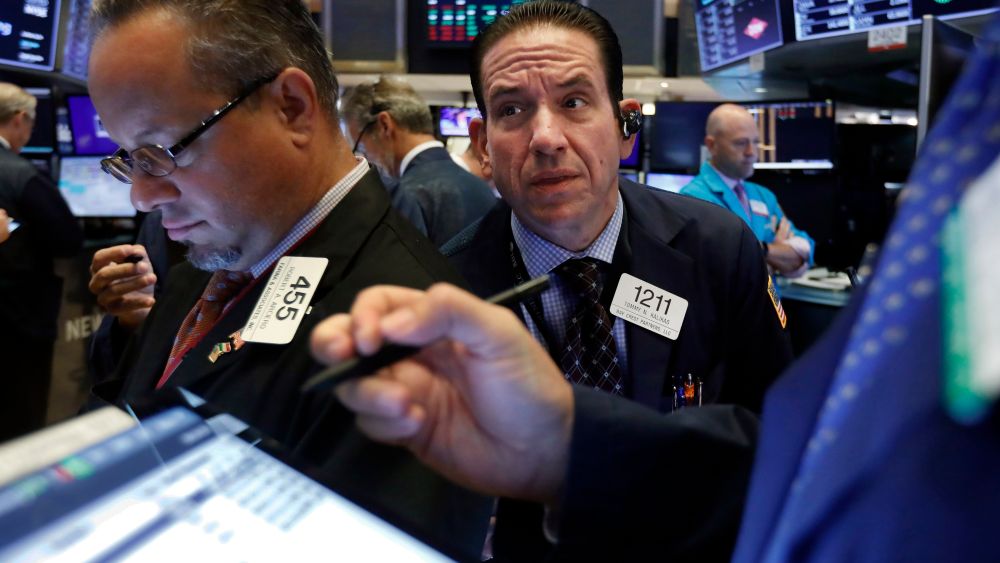 Trader Tommy Kalikas, center, works on the floor of the New York Stock Exchange. Stocks took a nosedive and bond prices spiked after President Donald Trump said the U.S. would raise tariffs on more Chinese goods, increasing the stakes in an ongoing trade battle. The market had been on track for its biggest gain in nearly two months Thursday, Aug. 1Financial Markets Wall Street, New York, USA - 31 Jul 2019
