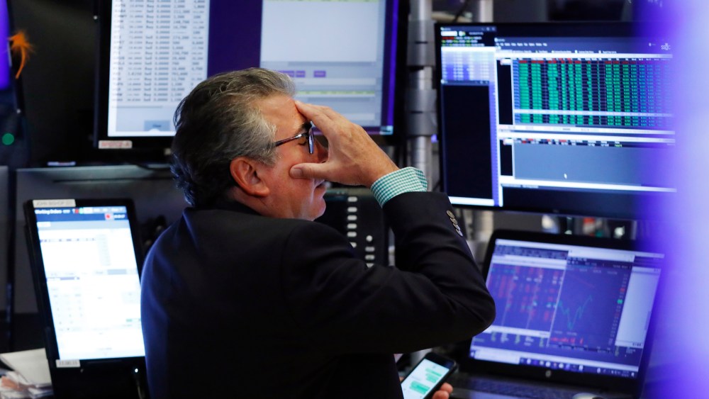 Trader John Bishop works on the floor of the New York Stock Exchange, . Stocks are plunging on Wall Street Monday on worries about how much President Donald Trump's escalating trade war with China will damage the economyFinancial Markets Wall Street, New York, USA - 05 Aug 2019