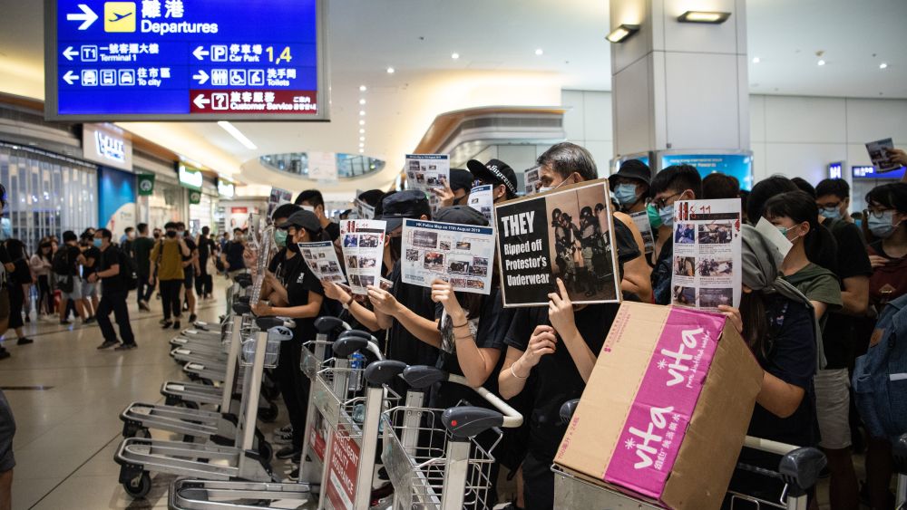 Protesters block the departures area in Hong Kong International Airport.