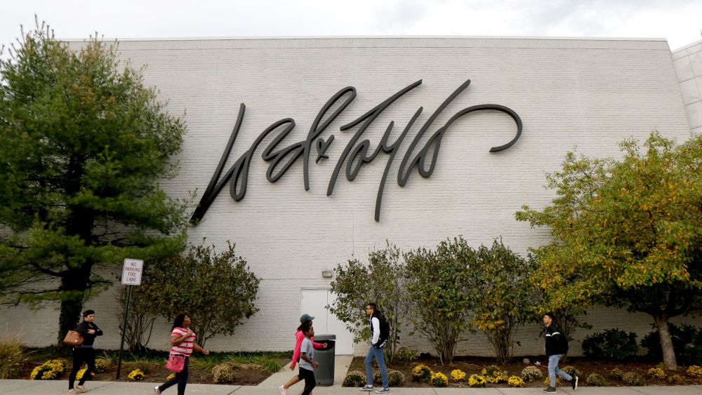 People walk on a sidewalk along the entrance to Lord & Taylor department store at Garden State Plaza, in Paramus, N.JNew Jersey Retailer Stores, Paramus, USA - 25 Oct 2017