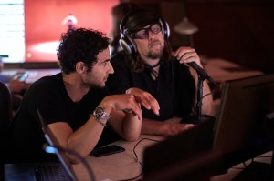 Zac Posen and Steven Sebring confer.