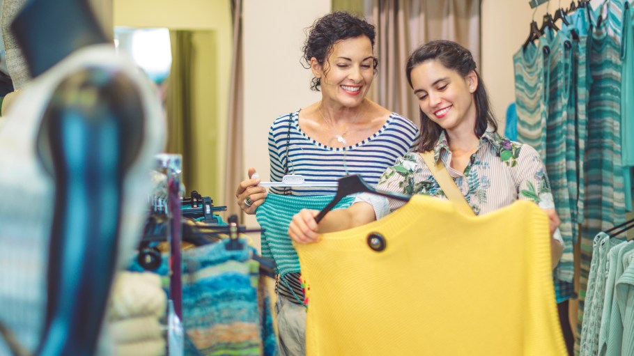 Mother and her adult daughter are buying clothes
