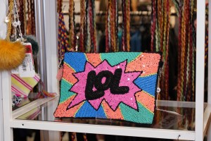 Michigan-based apparel manufacturer and online retailer America And Beyond was selling neon pieces, including this clutch. The company’s Director of Sales Natashka Manthen said she the colors were inspired by a wet suit in her closet from the Eighties.