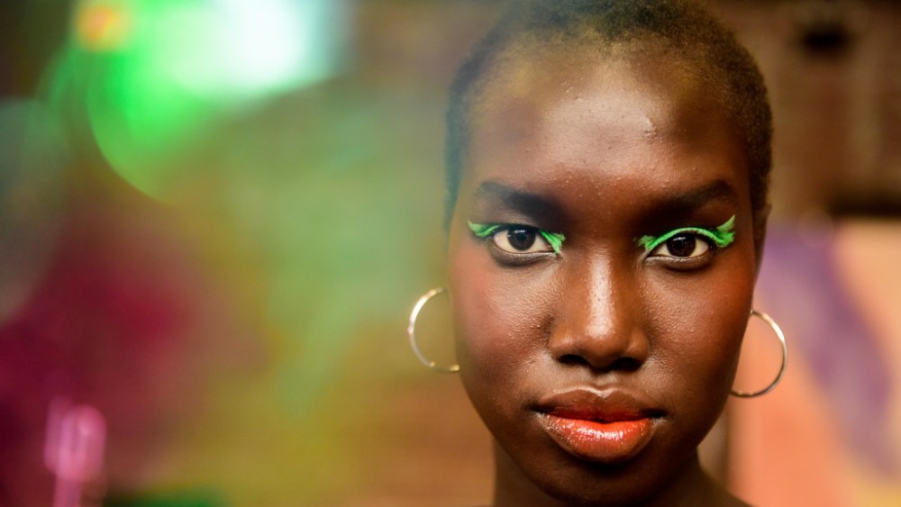 Romy Soleimani for Bobbi Brown swiped a custom shade of pistachio across lids, and kept the rest of the look colorful with coral blush and a bright orange lip. Ñ Ellen Thomas