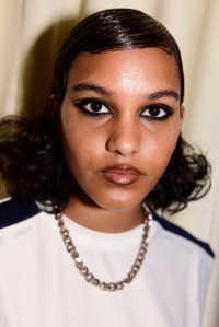 Drawn toward the Sixties and Seventies, lead makeup artist Emi Kaneko relied on black and brown eyeliners and glossy lips for the makeup look at Vaquera. "We wanted to marry the [Sixties and Seventies], bring it now and make it a New York cool girl," she said. "Just really wearable, but also a Vaquera version of wearable." Ñ Alexa Tietjen