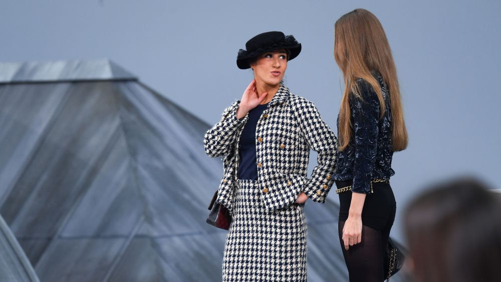 Gigi Hadid approaches a woman during the finale and escorts her off the catwalkChanel show, Runway, Spring Summer 2020, Paris Fashion Week, France - 01 Oct 2019