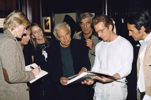 Ralph with Buffy Birrittella Jerry, Charles Fagan looking at a book.