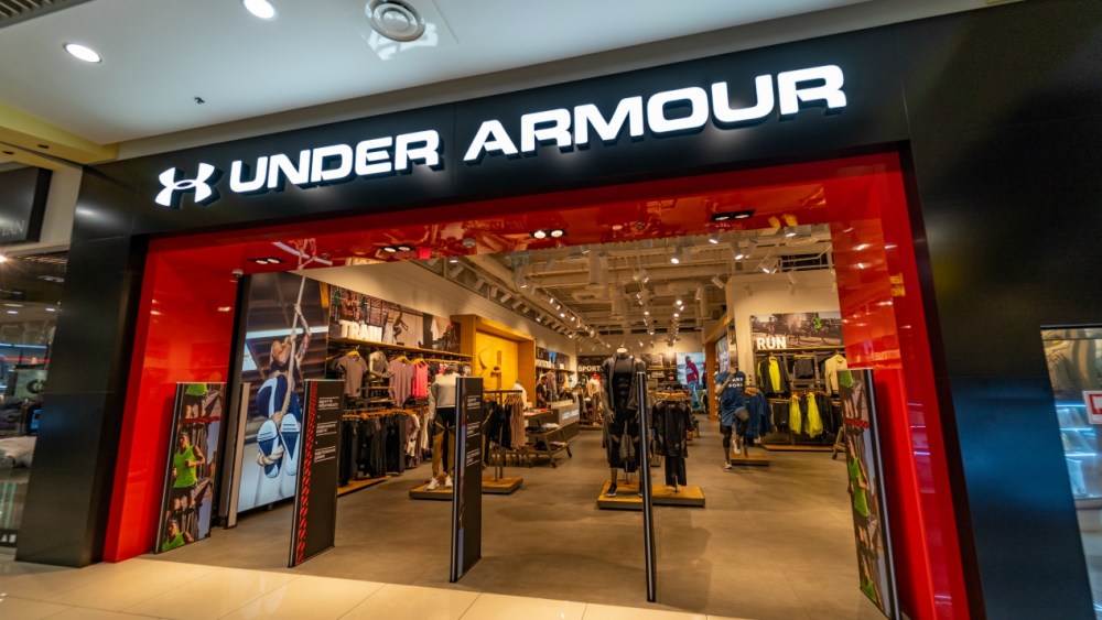 Under Armour faces sluggish sales and two federal accounting probes, which has the sportwear company lowering revenue guidance for FY2019.