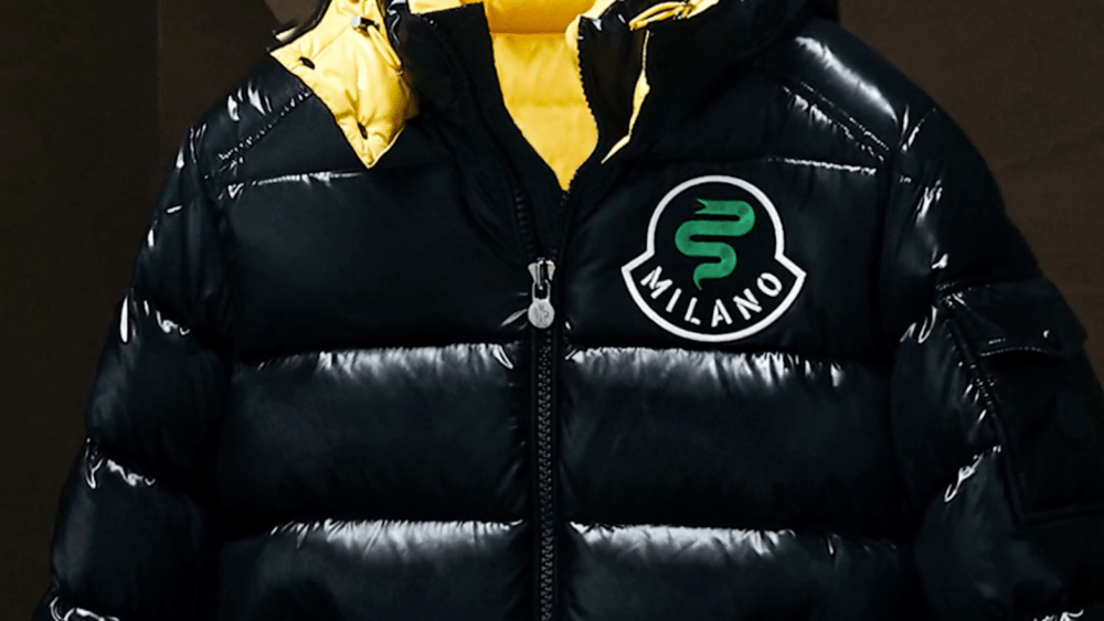 A Moncler puffer with a crest dedicated to Milan.