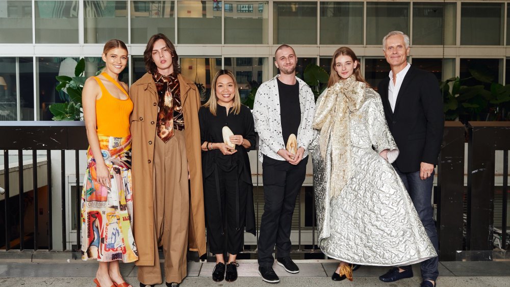 From left: Models Victoria Lee and Lachlan Mitchell, Australian Fashion Foundation 2020 scholarship winners Kim Clark and Domenic Roylance, model Sophie Turnbull and AUSFF co-founder Malcolm Carfrae, at the foundation’s annual Christmas party in Sydney, December 17, 2019.