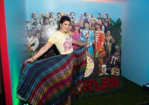 Amy Schechter in front of Sgt. Peppers Lonely Hearts Club pod.