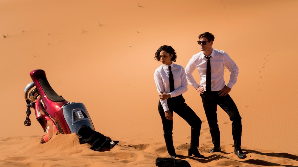 Tessa Thompson and Chris Hemsworth in Men in Black International. Paul Smith designed all the suits for the movie.