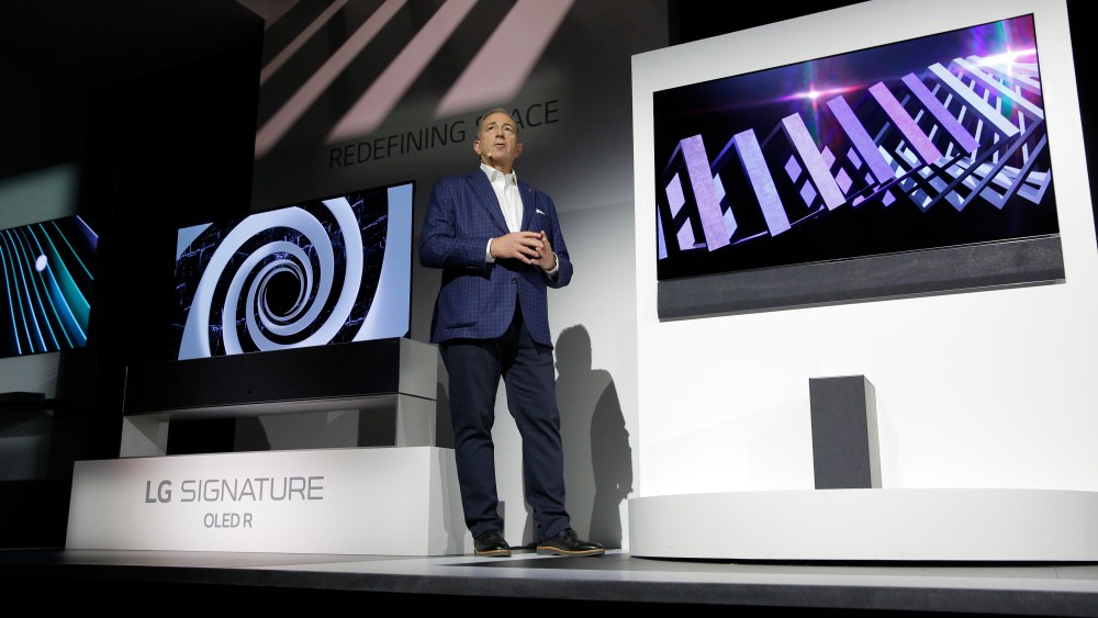 Tim Alessi, head of home entertainment product marketing for LG Electronics USA, unveils a GX series of OLED TV during a LG news conference ahead of CES