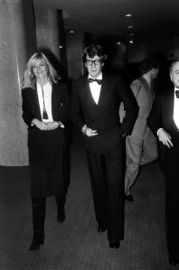 Betty Catroux and Yves St. Laurent attending Sao Schlumberger's party to celebrate Francois Marie Banier's first play "Hotel du Lac" in the Grand Hotel, 1975.