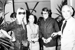 Betty Catroux, Helene Rochas and Yves Saint Laurent after a showing of YSL's fall 1976 couture collection.