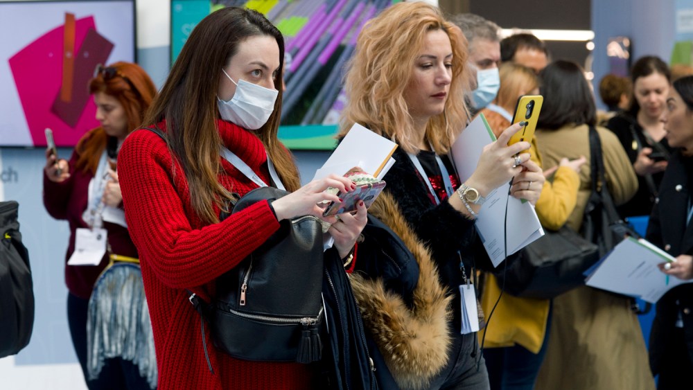 Masked visitors in the main trend forum of Premiere Vision Paris trade show.