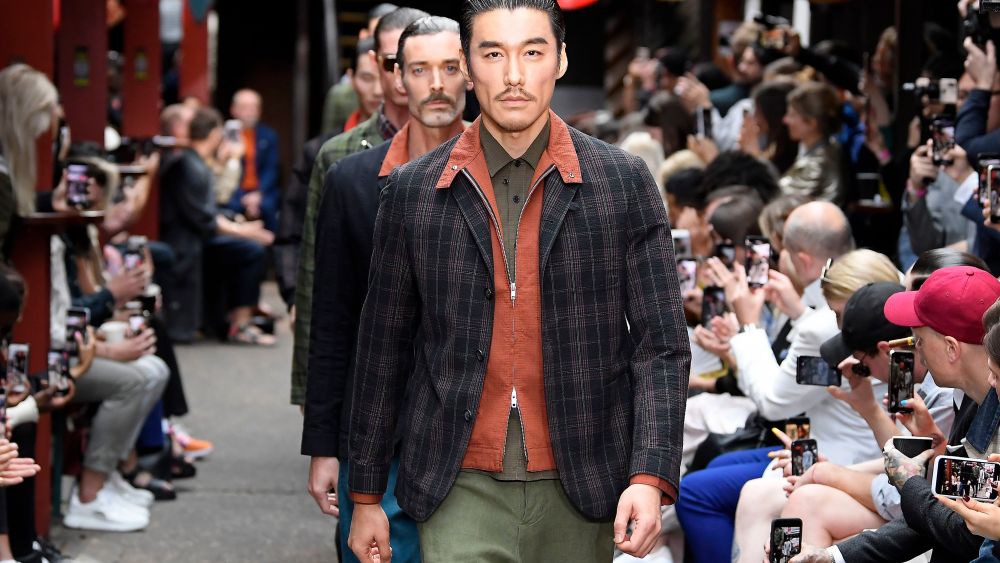 Hu Bing and models on the catwalk Oliver Spencer show