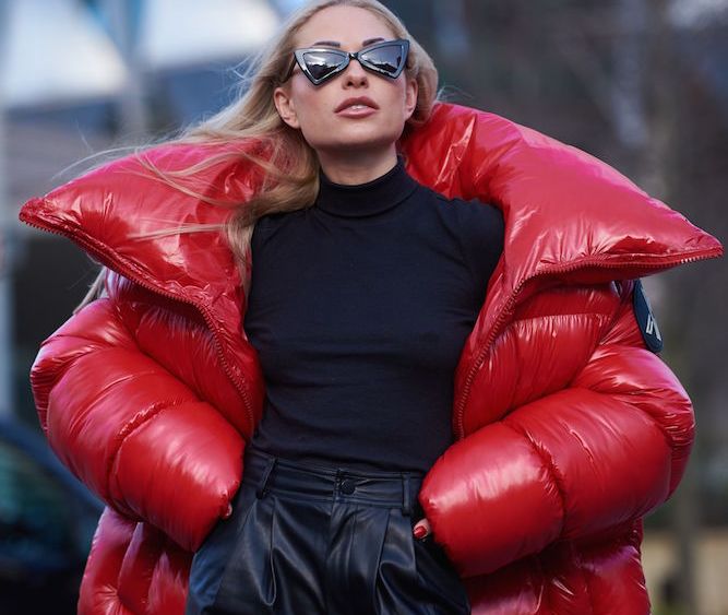 Voluminous skirts, puffed sleeves and extra-large winter accessories were among the bold street style looks at London Fashion Week.