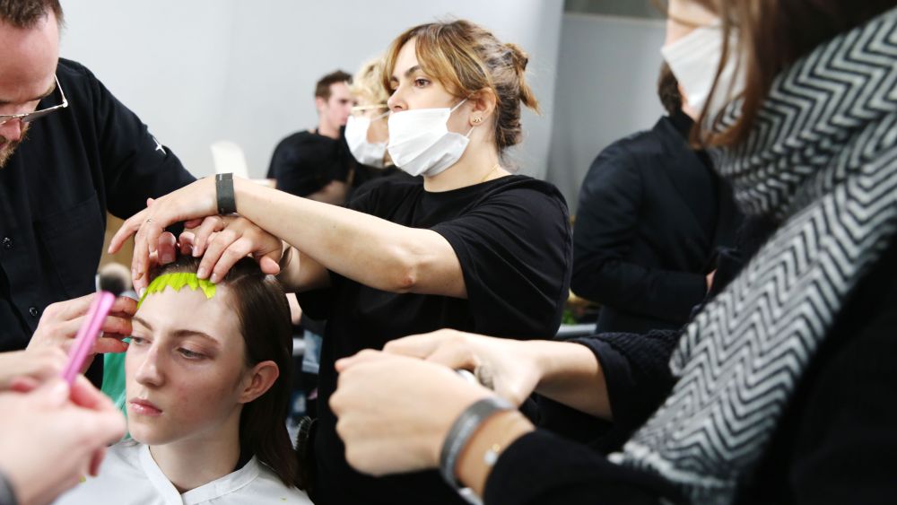 Models and make up artists wearing hygiene masks backstageDries van Noten show, Backstage, Fall Winter 2020, Paris Fashion Week, France - 26 Feb 2020