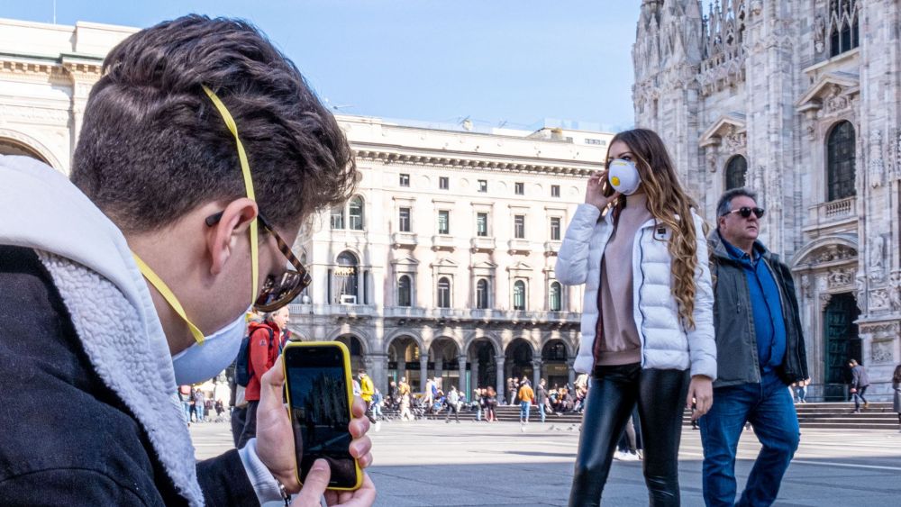 People wearing masks in Piazza DuomoCoronavirus outbreak, Milan, Italy - 24 Feb 2020