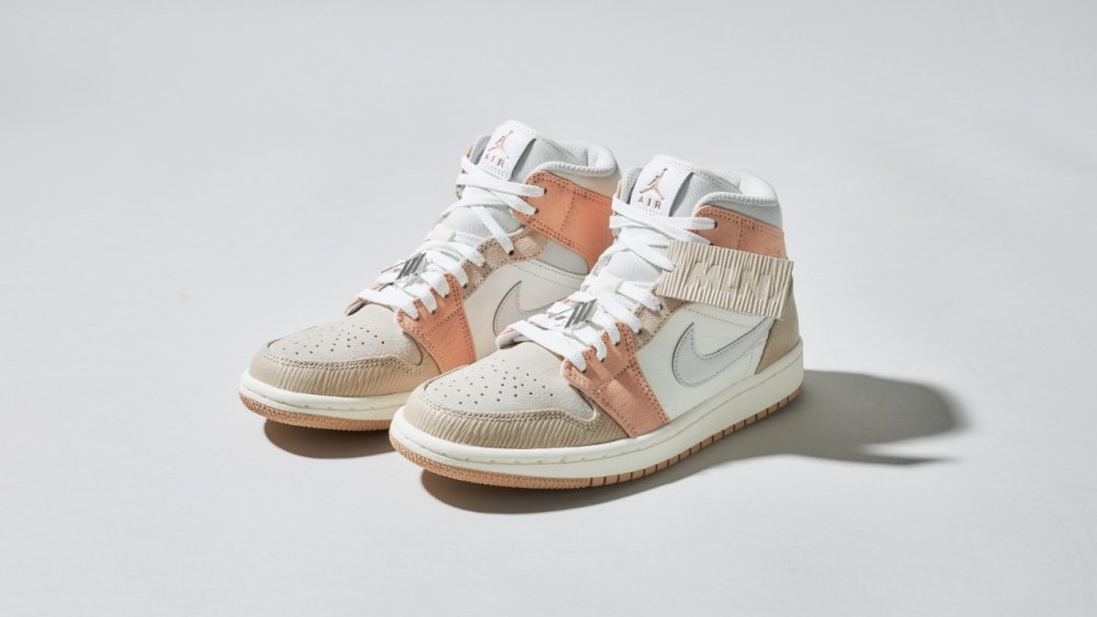 The new “Air Jordan 1 Mid Milan” sneaker with The Attico logo pin.