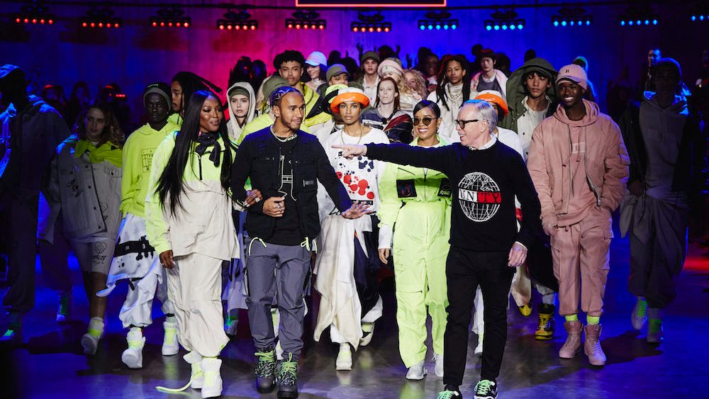 The TOMMYNOW Spring 2020 runway experience at London Fashion Week featured a Tommy x Lewis x H.E.R. collection that merged generations.