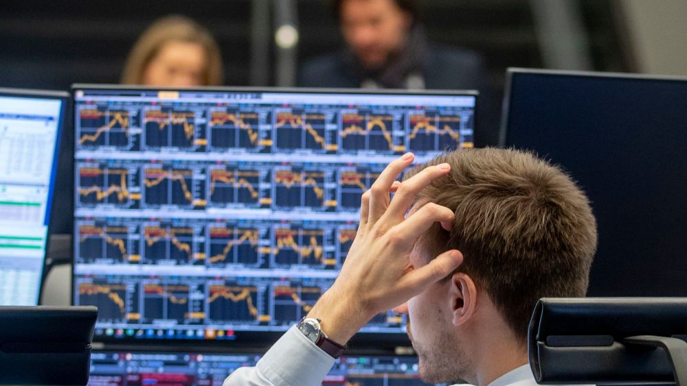A broker scratches his head as he looks at his screens at the stock market in Frankfurt, GermanyStock Market, Frankfurt, Germany - 09 Mar 2020