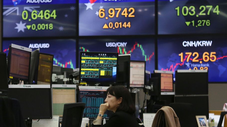 Currency trader watches monitors at the foreign exchange dealing room of the KEB Hana Bank headquarters in Seoul, South Korea, . Asian shares plunged Thursday after the World Health Organization declared a coronavirus pandemic and indexes sank on Wall Street Financial Markets, Seoul, South Korea - 12 Mar 2020