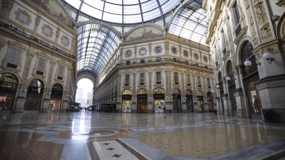 The Vittorio Emanuele shopping arcade looks almost desert, in Milan, Italy.
