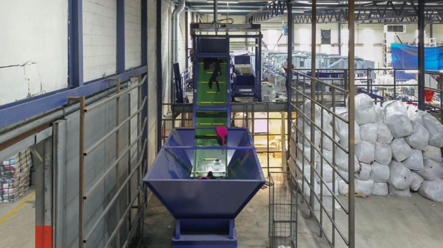 The Fibersort is a machine that automatically sorts large volumes of mixed post-consumer textiles by fiber composition and color.
