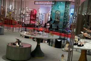 Christian Louboutin’s shop-in-shop features a ceramic fountain and aged brass vines.