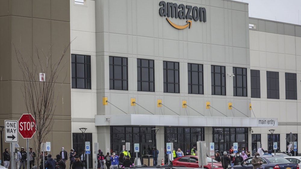 Workers at Amazon's fulfillment center in Staten Island, N.Y., gather outside to protest work conditions in the company's warehouse, in New York. Workers say Amazon is not doing enough to to keep workers safe from the spread of COVID-19 and coronavirusVirus Outbreak-Amazon, New York, United States - 30 Mar 2020