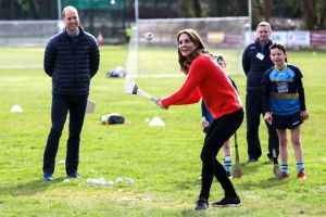 Kate Catherine Duchess of Cambridge, center, gestures as she tries hurling next to Britain's Prince William at Salthill Knocknacarra GAA Club in Galway, Ireland,. The Duke and Catherine Duchess of Cambridge visit Galway on the last of a three-day official visit to IrelandIreland Royals, Galway - 05 Mar 2020