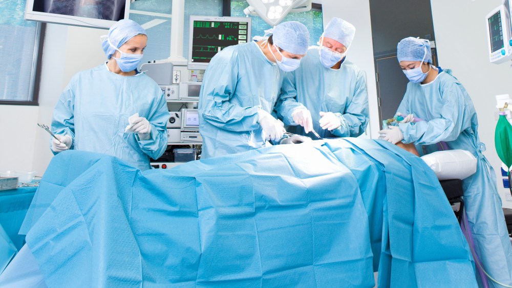 Concentrating surgeons performing operation in operating room