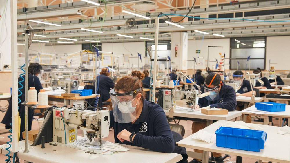 Workers make masks at the Loewe factory.