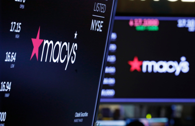 The logo for Macy's appears above posts on the floor of the New York Stock Exchange, . Macy's rose 2.9 percent after the department store giant said it will cut 2,000 corporate jobs and close 125 of its least productive storesFinancial Markets Wall Street Macy's, New York, USA - 05 Feb 2020
