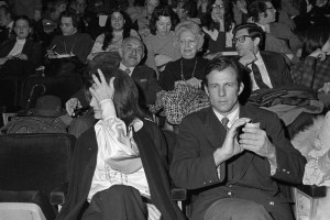 Jacqueline Kennedy Onassis seated next to Peter Beard at a screening of "The Day of the Dolphin" at the Ziegfeld Theater in New York, 1973.