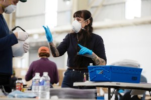Workers from Bednark Studio and Duggal Visual Solutions are part of a group effort making face shields in The Brooklyn Navy Yard.