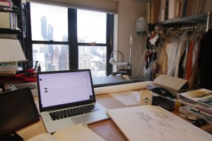 Sketches sit atop Leetal Platt's work station where the tech pack is pulled up on the screen.