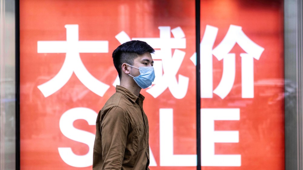 A man walks on the street in Guangzhou, China.
