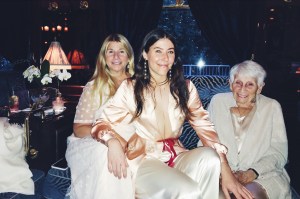 MARKARIAN – “This is a photo of one of my favorite memories with my mom and grandmother. We took the Orient Express from Vienna for my grandmother, GiGi’s, 90th birthday. We are each 30 years apart (60 for me and GiGi), so it was a big year of birthdays for all three of us. We decided to go on a trip together to celebrate. Every detail of the train was so beautiful and seemed like it was lost in time. Everyone was dressed up for dinner and retired to the bar car, where this photo was taken, for drinks afterward. All three of us are wearing our Markarian outfits in this photo, which made the occasion even more special and memorable for me.”
