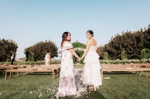 Morgan Lane – “This photo was taken of me and mom on my wedding day right after the ceremony. I got married in Spain and remember taking my mom there early on to do
planning and tastings. We made it our last special trip together before she gave me away. We had the best time just the two of us galavanting around Mallorca after we finished doing the planning in Casares. I remember taking a yoga class with her at the hotel one morning, it was very early and we are not that into yoga. The teacher was really over the top into it, and it was so slow we couldn’t stop laughing. I remember laughing so hard I couldn’t breathe and everyone in the class was looking at us so we snuck out and went shopping.”