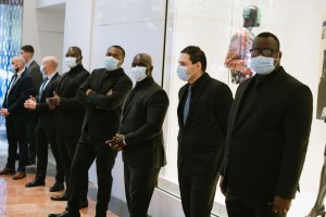 Security guards wait to greet shoppers at the Galeries Lafayette flagship on Boulevard Haussmann in Paris.