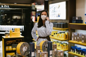 A sales associate at the Acqua di Parma stand at the Galeries Lafayette flagship on Boulevard Haussmann in Paris.