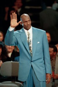 Former Chicago Bulls star Michael Jordan waves to the crowd as he is introduced at the United Center in Chicago, . The Bulls honored Jordan with ceremonies to permanently retire his number 23. A 12-foot bronze statue of Jordan was also unveiled outside the United Center
Michael Jordan, CHICAGO, USA