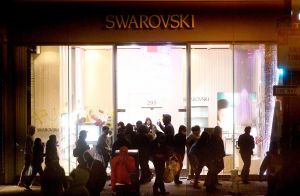 People vandalize a Swarovski store in San Francisco's Union Square.