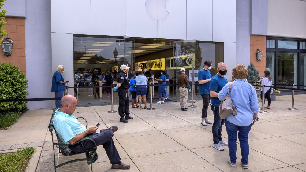 People wait in line to enter a reopened Apple Store at The Summit shopping center in Birmingham, Alabama, USA, 13 May 2020. A handful of Apple's US retail stores are being reopened with strict social distancing guidelines for customers amid the coronavirus COVID-19 pandemic. The spread and containment efforts of the coronavirus COVID-19 pandemic has caused disruptions to daily life across the globe.Apple Store reopening amid the coronavirus COVID-19 pandemic in Birmingham, Alabama., USA - 13 May 2020