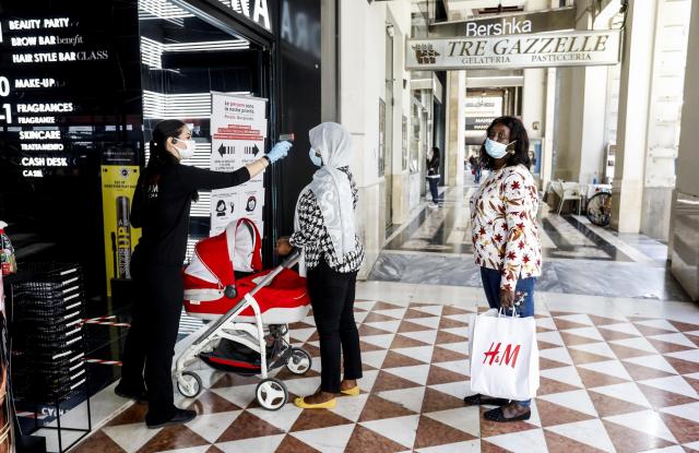 Shopping on the first day of reopening of the clothing stores after the lockdown due to the Coronavirus emergency in Milan, Italy, 18 May 2020. Several countries around the world have started to ease COVID-19 lock-down restrictions in an effort to restart their economies and help people in their daily routines after the outbreak of coronavirus pandemic.Coronavirus in Italy, Phase 2, Milan - 18 May 2020
