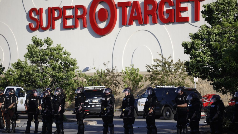 Minnesota State Police protect a Target Store, in St. Paul, Minn. Violent protests over the death of George Floyd, the black man in police custody broke out in Minneapolis for a second straight night Wednesday, with protesters in a standoff with officers outside a police precinct and looting of nearby storesMinneapolis Police Death, St. Paul, United States - 28 May 2020